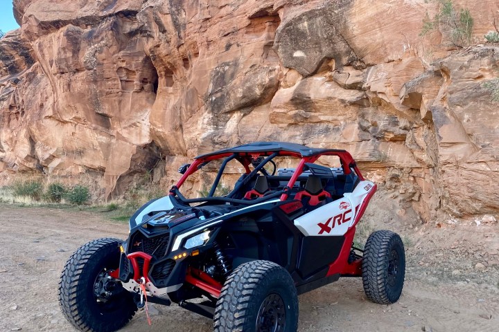 a motorcycle parked on the side of a mountain